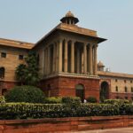 Stunning classical architecture of a historic government building in New Delhi, India.